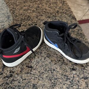 Nike Kids Black Sneakers with Red and Blue Accents